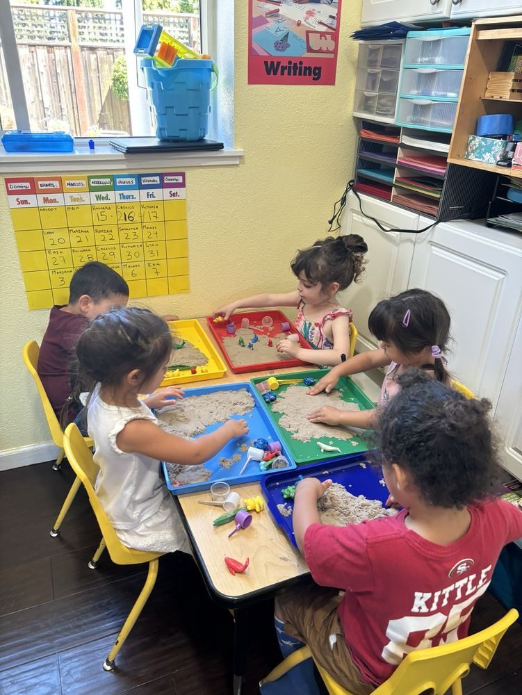 Children working at the learning table with hands-on materials
