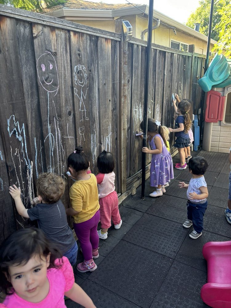Backyard chalk wall where the children draw outside